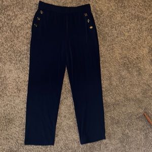 Blue dress pants gold buttons.